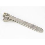 A c1970s silver mounted cigar cutter, 17.5cm, marked M.W & Co