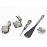 A small collection of silver items and jewellery, including two vesta cases, a silver handled button