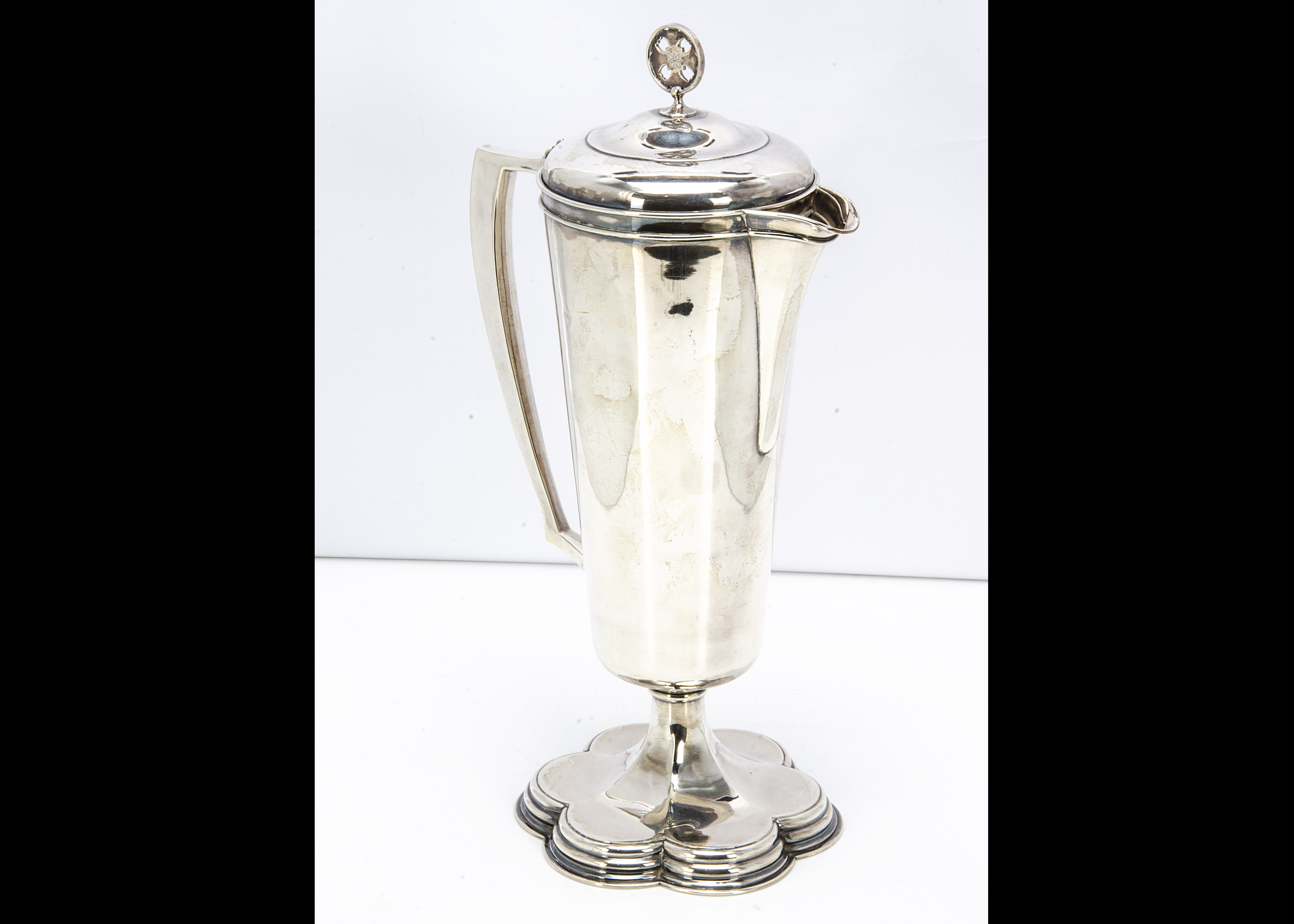 A 1960s silver ecclesiastical claret jug, by B & W, tapered body with handle, hinged cover with