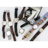 A small group of watches, including two Swatch watches in a Swatch box, a Tissot, a Seiko quartz,