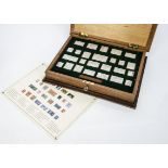 A 1970s Hallmark Replicas set of commemorative stamp silver ingots, 25 stamp shaped silver ingots in