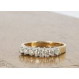 A contemporary 18ct gold seven stone diamond ring, ring size N, 0.50ct diamonds, 3.7g