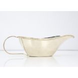 A c1970s century Egyptian white metal sauce boat, 4.97 ozt, with bead rim and loop handle, three