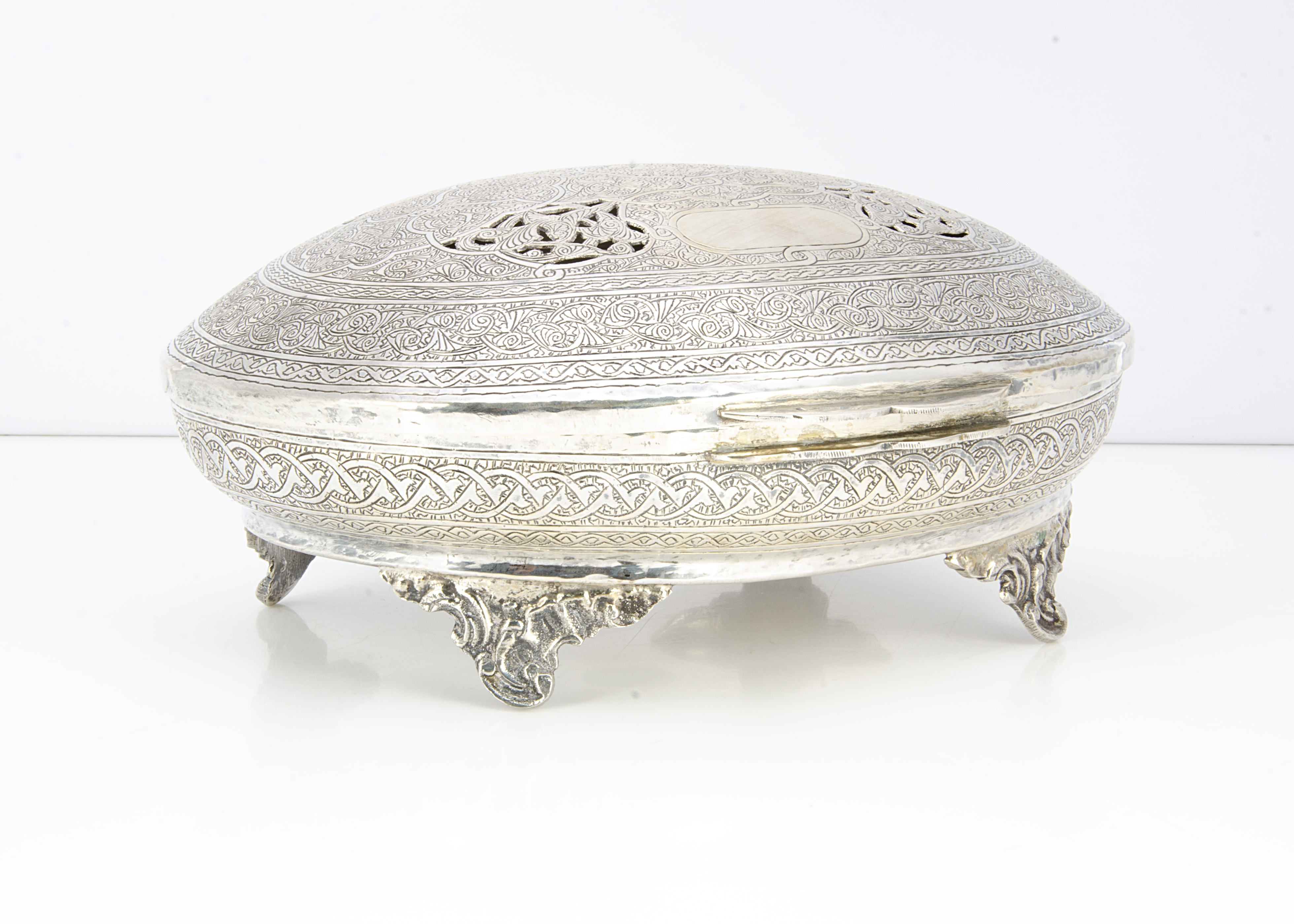 A c1970s century Egyptian white oval box, 30.7 ozt, and 25cm wide, with engraved and pierced