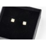 A pair of brilliant cut diamond stud earrings, in four claw settings, diamond weight 0.16ct, 1g