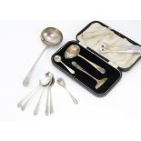 A small group of silver flatware and other items, including a cased baby feeding set, a sauce