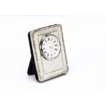 A small modern silver fronted desk clock, marked Kitney & Co, 6.7cm H