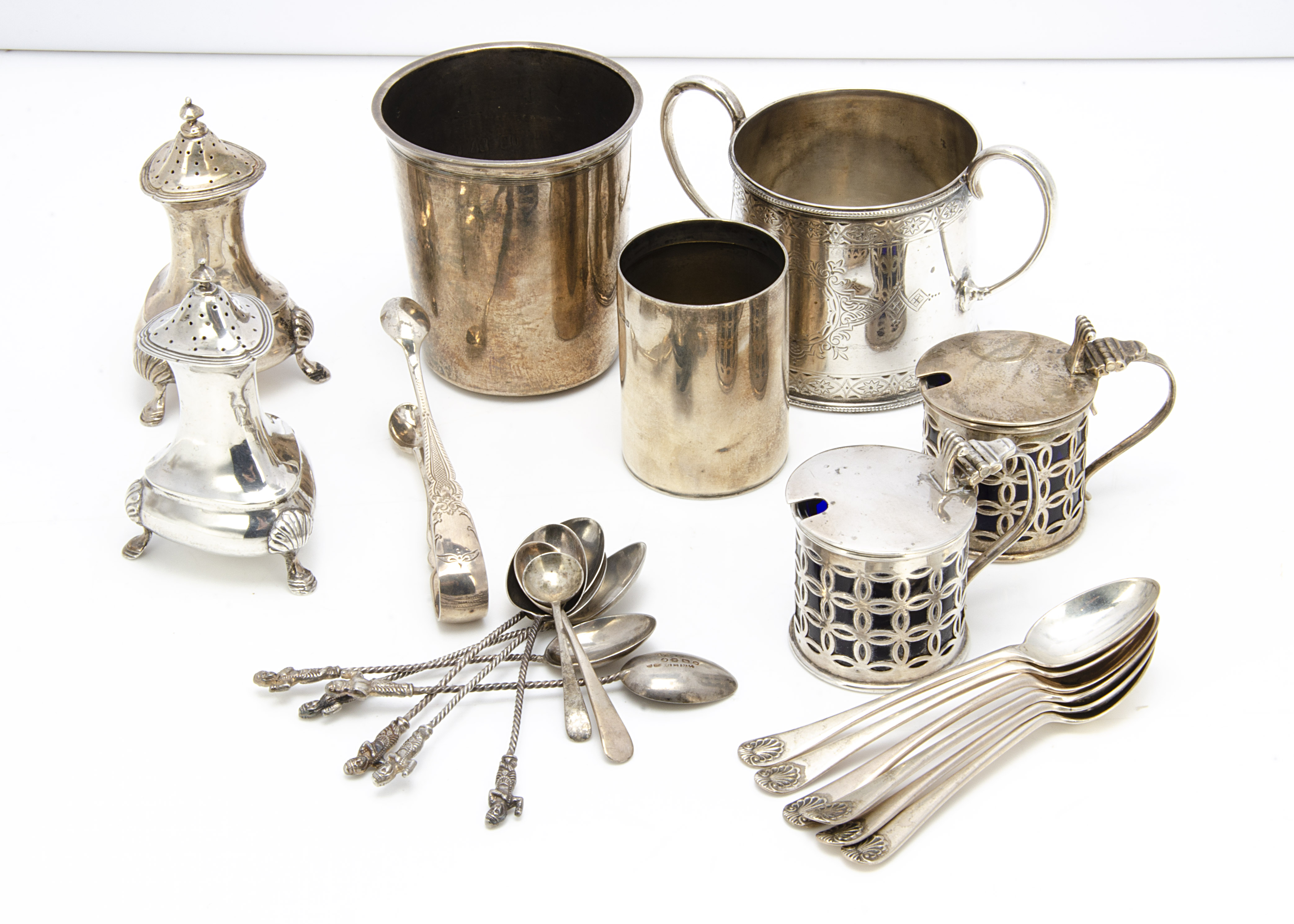 A collection of silver, including a silver sugar basin, a nice set of six coffee spoons, a pair of