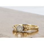 A continental yellow metal and diamond solitaire, the brilliant cut in illusion setting with stepped