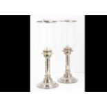 A pair of modern silver plated and glass candle holders by Megaline of Denmark, candle supports with