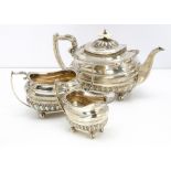 A Edwardian three piece silver tea set by Walker & Hall, Sheffield 1904, 45.7ozt