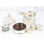 Seven Victorian and 20th century silver items, including a sauce boat by GH, impact dent to foot,