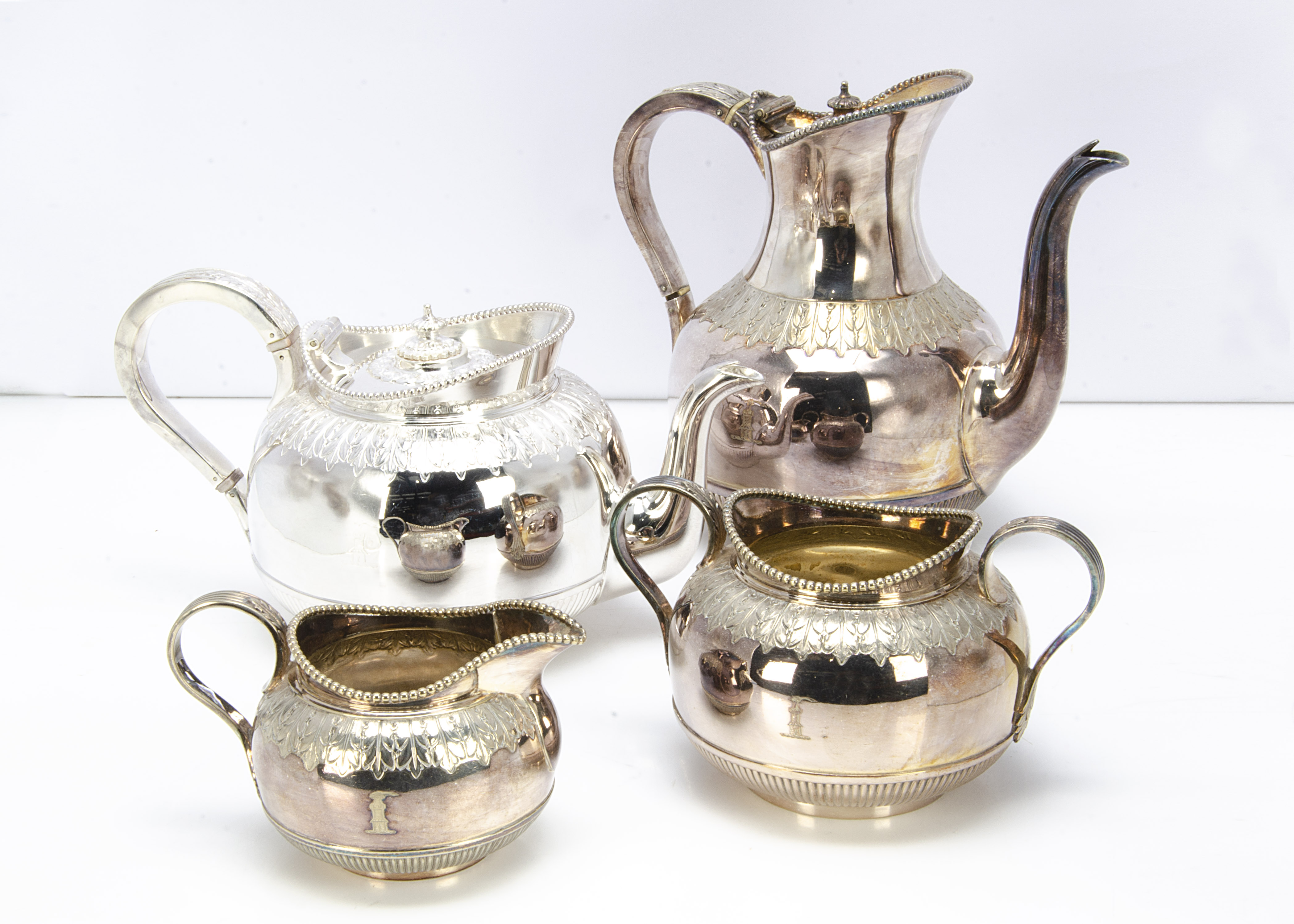 A nice Victorian silver plated four piece tea and coffee set from M H & Co, each piece bearing