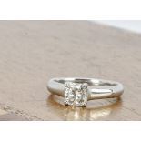 A Tiffany & Co diamond and platinum solitaire ring, the asher cut diamond in four claw setting on