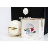 A Chanel 2016 Happy New Year white plastic and gilt metal paste set spherical clutch bag, in white