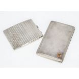 Two Art Deco period silver cigarette cases, 12.45 ozt, the larger 14.5cm and with applied gold panel