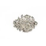 An Indian white metal and paste set floral brooch, 6cm x 4.1cm, 20g