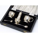 A 1960s three piece cruet set from CSG & Co, in fitted box with spoons