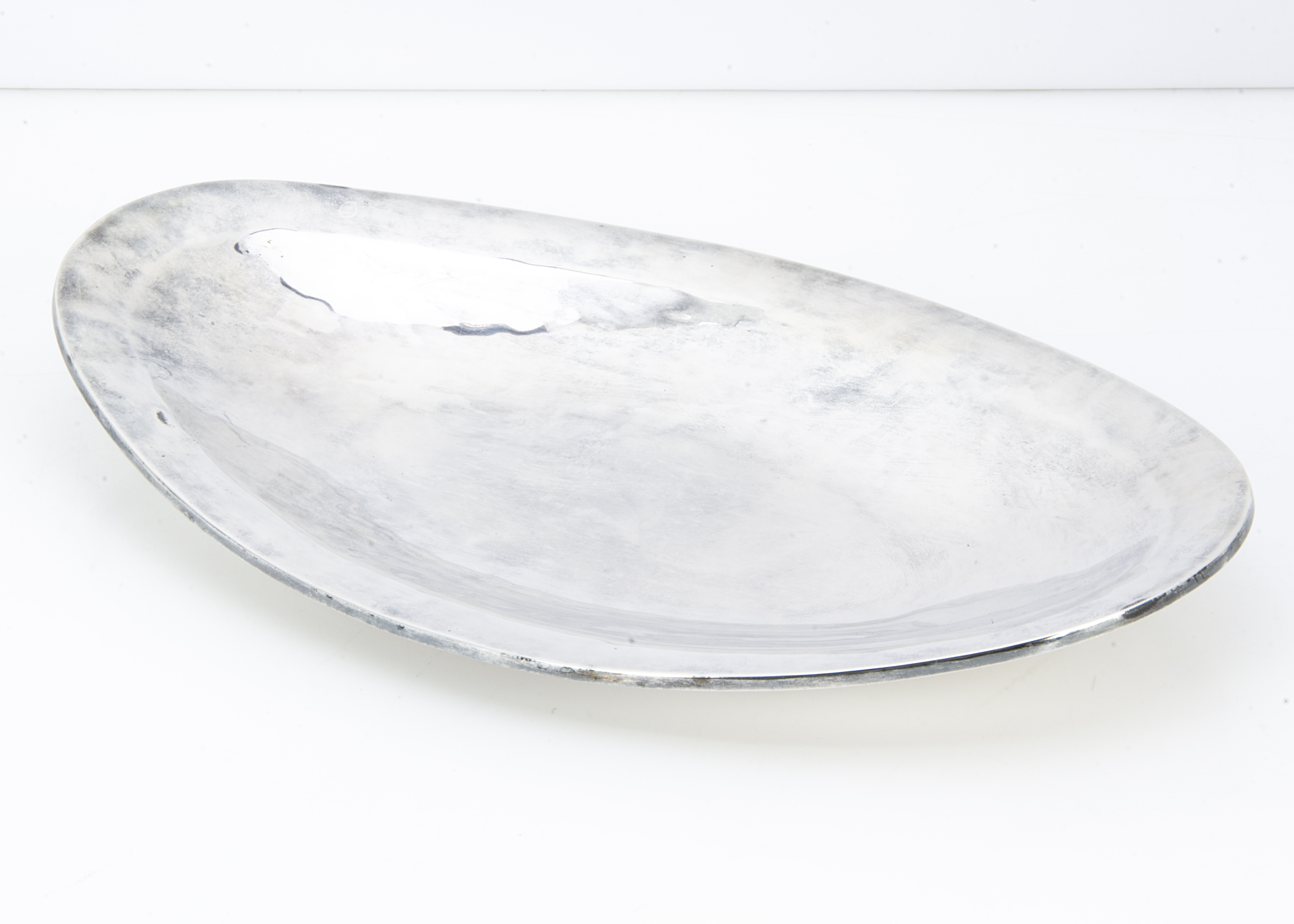 A c1970s Mexican white metal dish, 11 ozt, 30.5cm wide, oval, marked 925 with other markings