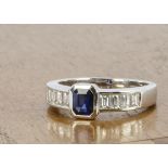 An 18ct white gold Art Deco style sapphire and diamond dress ring, the rectangular cut sapphire