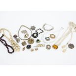 A collection of costume jewellery, including a string of simulated amber barrel shape beads, various