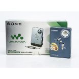 Sony Walkman, a Sony Walkman WM-EX631 model with AC charger, stand, headphones with LCD remote
