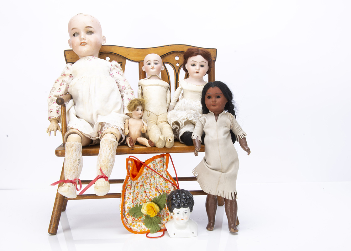 Five bisque-headed dolls, a Darling shoulder-head with kid body --13½in. (34.5cm.) high; a brown