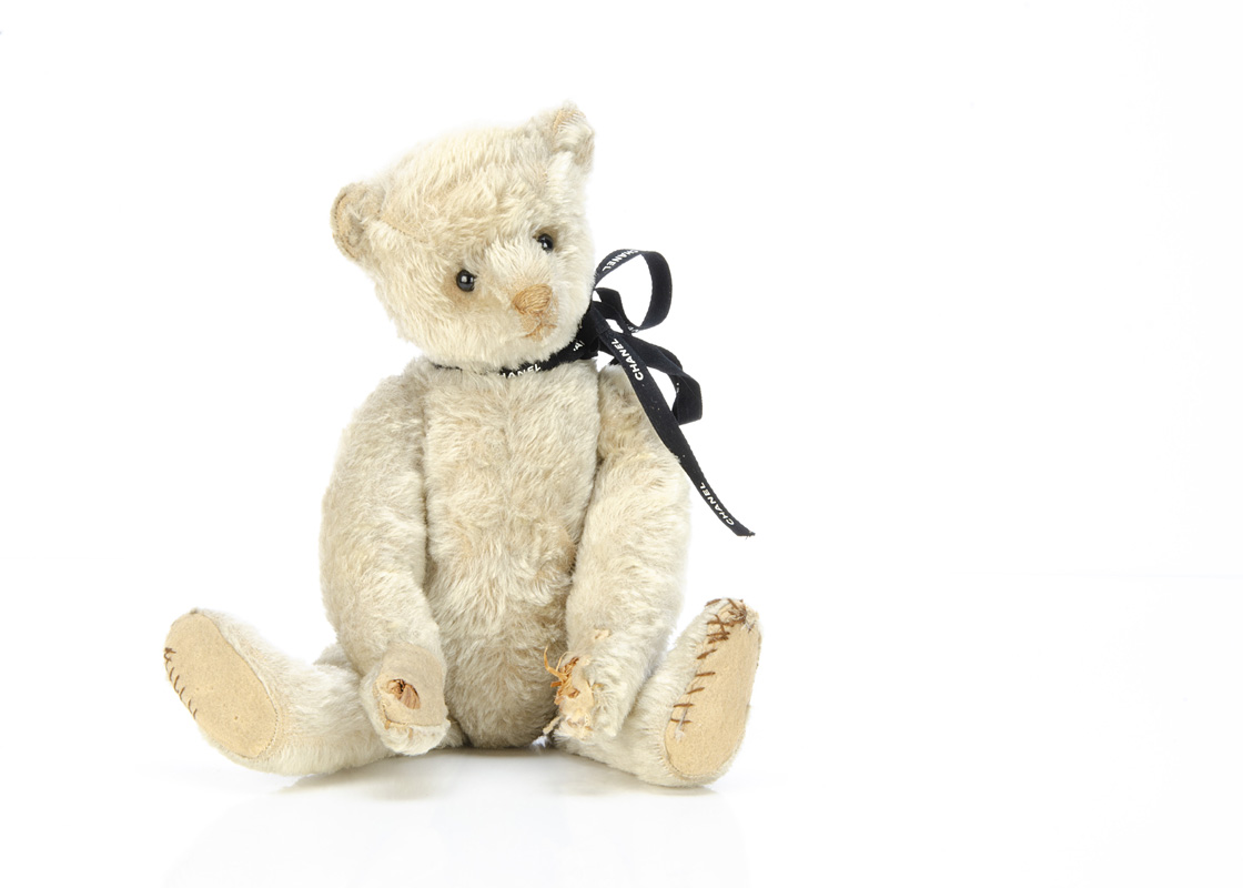 A rare early Bing white mohair teddy bear circa 1908, with black boot button eyes, pronounced