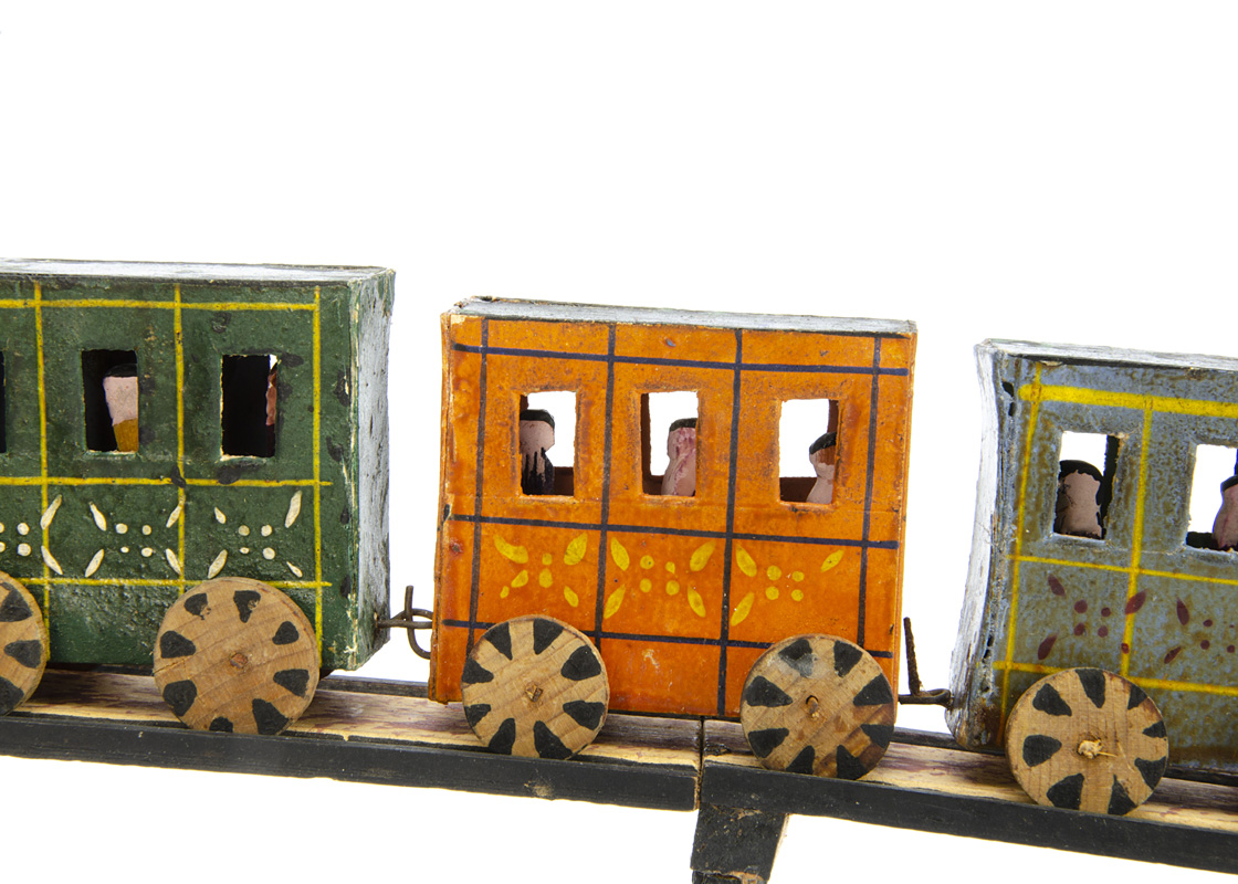 A rare Erzgebirge mid 19th Century painted wooden train, a black painted engine with large chimney - Image 3 of 3