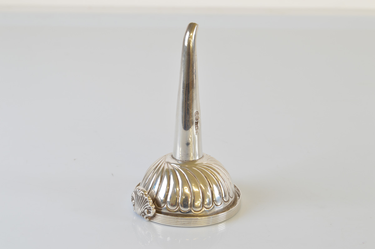 A contemporary silver wine funnel, in the 18th century style with removable grill and shell thumb