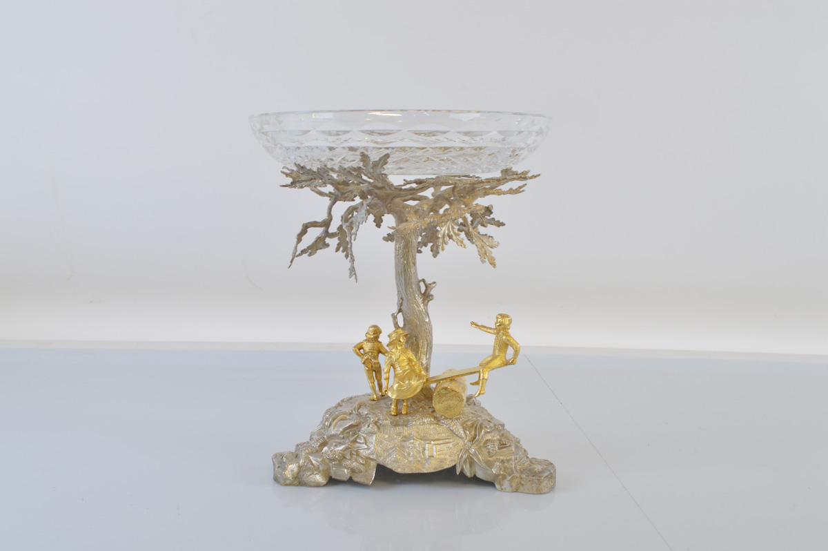 A contemporary cast silver and silver gilt centrepiece, depicting children at play underneath an Oak