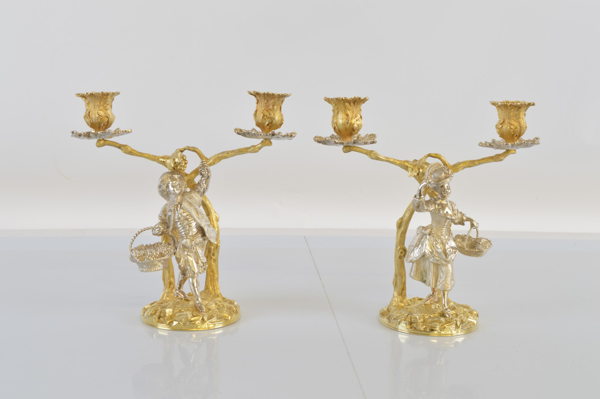 A pair of contemporary cast silver and silver gilt figural candlesticks, in the Georgian style