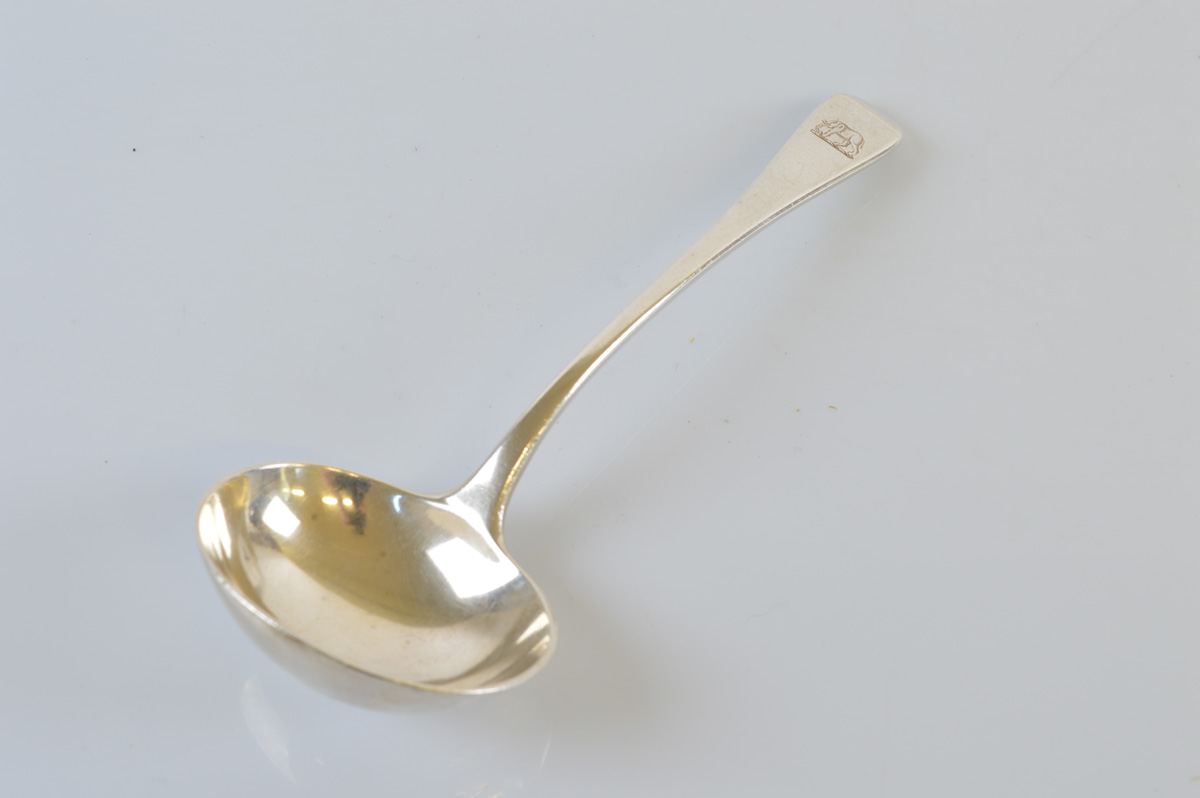 An George V Old English pattern silver ladle, with Elephant engraved terminal. London, 1927. 65g.