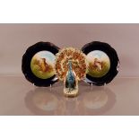 A pair of mid 20th century Rosenthal porcelain bird themed plates, 23cm diameter, together with a