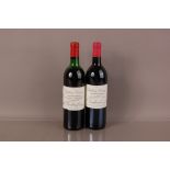 Two vintage bottles of Chateau Cissac Haut Medoc red wine, a 1983, level on shoulder, and a 1995,