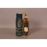 A limited edition 700ml botlle of Bushmills Millenium Single Malt Whiskey, numbered 333/22, with