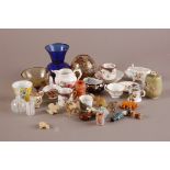 A collection of Objet d'art, including miniature cups and saucers, a miniature curling stone,