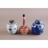 A Chinese Imari bottle vase, 20cm high, together with two oriental ginger jars, one having pewter