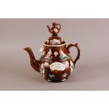 A late Victorian Bargeware pottery teapot, 30cm, marked God Bless Our Home, with teapot lid