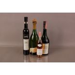 Four bottles of vintage and modern alcohol, including an Inniskillin Ice Wine, a small Leopard