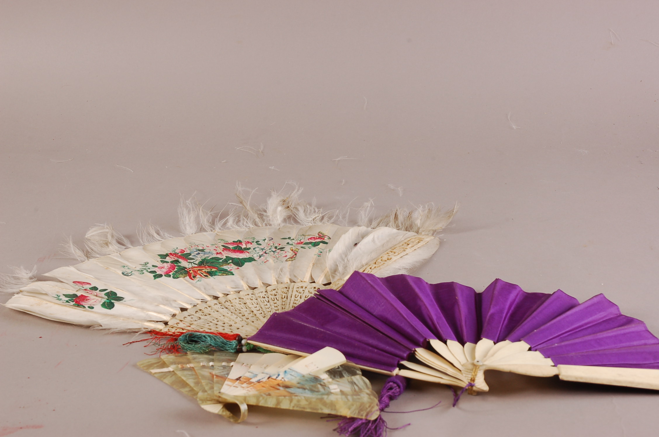 An assortment of vintage hand fans, including, ivory, bone and wooden examples, mainly silk with - Image 3 of 3