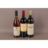 A bottle of 1989 Chateau Lynch Moussas red wine, together with a Chateau de Cruzeau 1989 white wine,