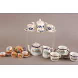A small group of dolls' house pottery tea set items