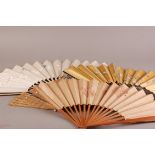 An assortment of vintage hand fans, including, ivory, bone and wooden examples, mainly silk with