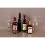Four modern bottles of spirits and a pair of glass ewers, inlcuding Sipsmith Sloe Gin, a small