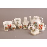 A small collection of crested ware and Goss, including a teapot with Westerham crest by Goss, a Goss