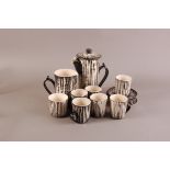 A mid 20th century studio pottery coffee set for six by Leaper of Newlyn, with black striped