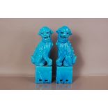 A pair of 20th century Chinese porcelain temple dog figures, 31cm, in rich turquoise glaze (2)