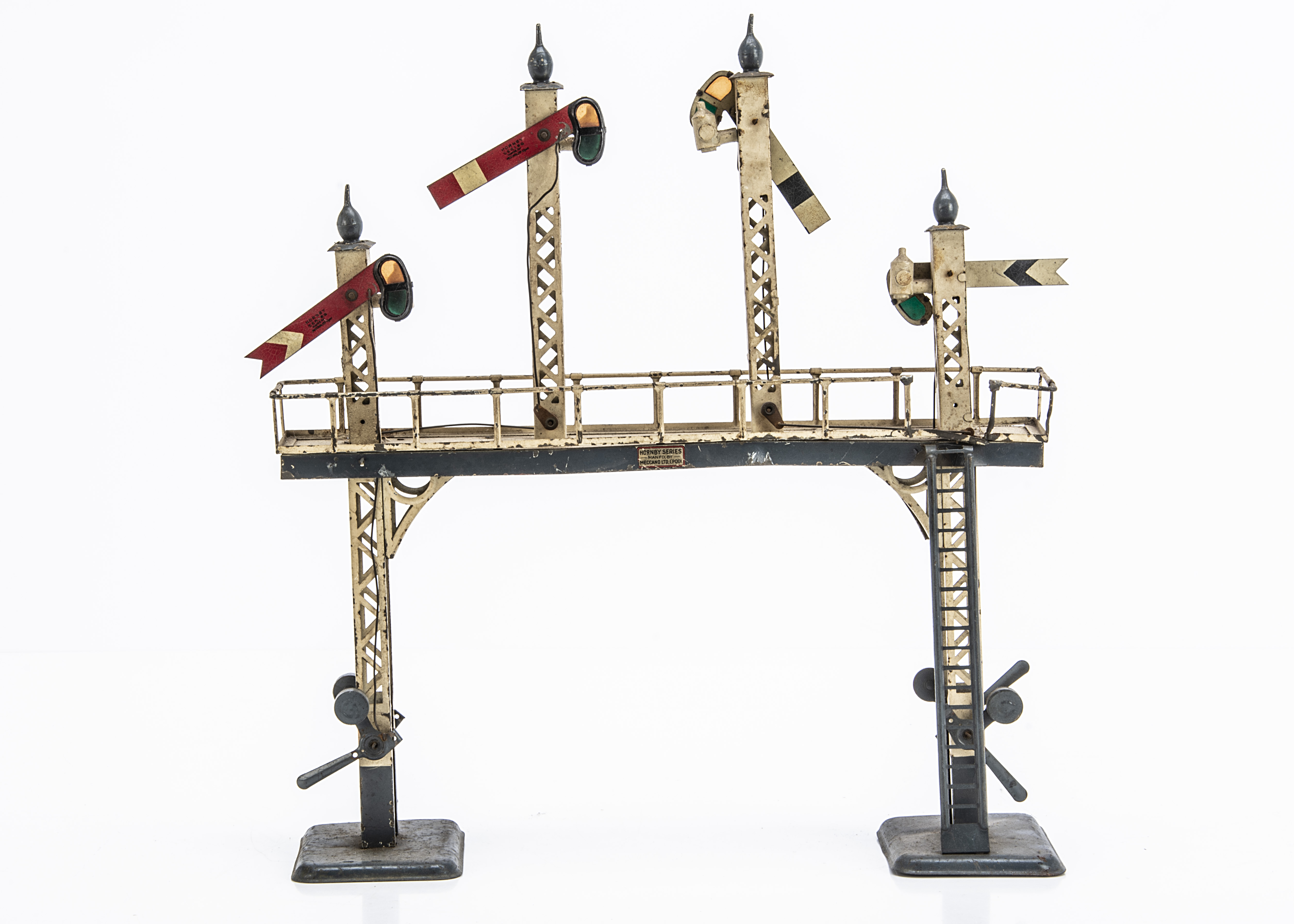 An early Hornby 0 Gauge No 2 Signal Gantry, with grey bases, finials and trim to bridge, two distant