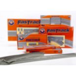 Modern Lionel 0 Gauge 3-rail 'Fastrack', boxed items including 6-12050 crossing, 6-81953 LH large-